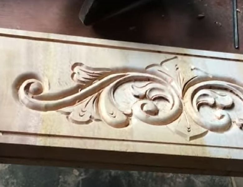 Carving designs in wood with a router